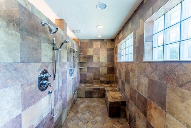 bathroom featuring tiled shower