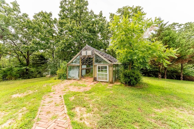 view of outbuilding featuring a yard