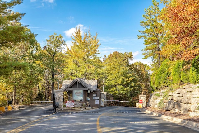 411 Silverwood Cir, Branson West, MO 65737 - view of road featuring traffic signs, a gated entry, and curbs