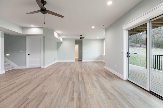 unfurnished living room with ceiling fan and light hardwood / wood-style flooring