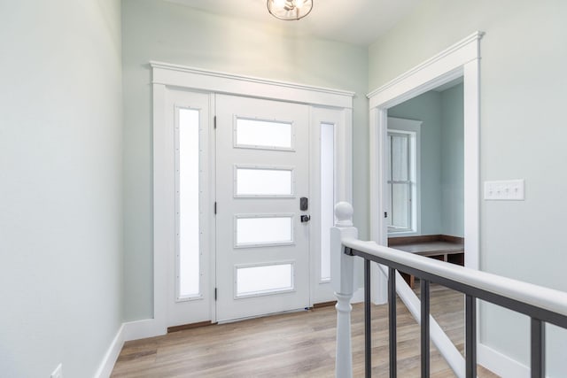 foyer entrance with light wood-type flooring