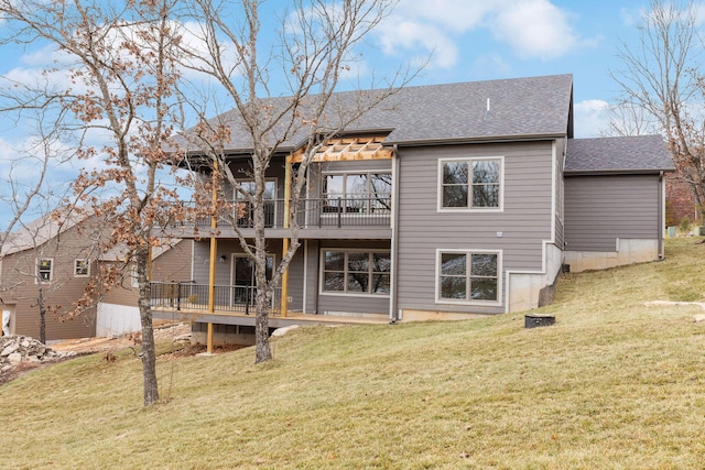 back of house featuring a wooden deck and a yard