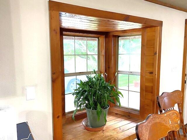 doorway with wooden ceiling