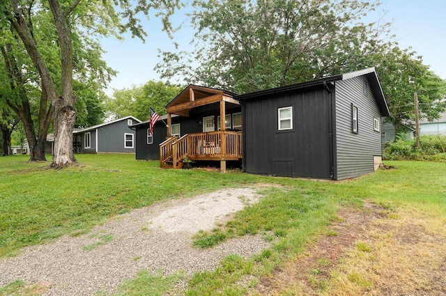 exterior space featuring a deck and a yard