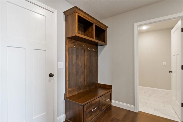 mudroom with dark hardwood / wood-style flooring