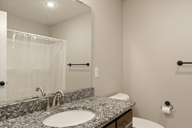 1641 N Pinnacle Ave, Nixa, MO 65714 - bathroom with vanity, curtained shower, toilet, visible vents, and recessed lighting