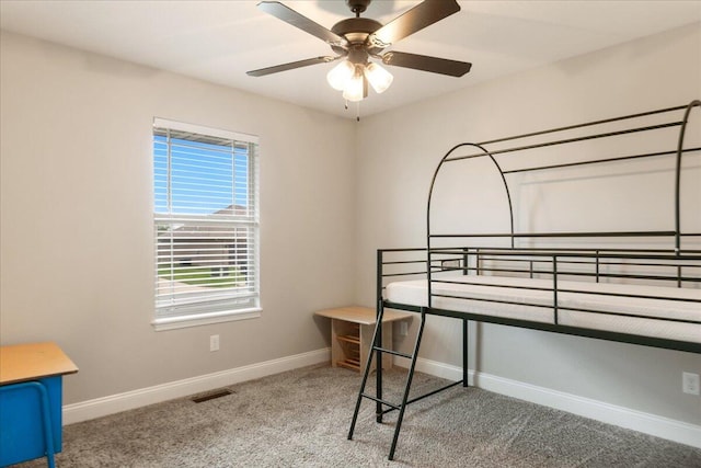 unfurnished bedroom featuring carpet and ceiling fan