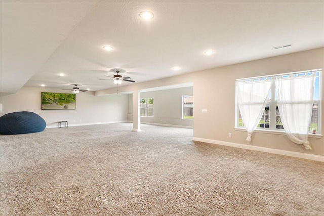 1641 N Pinnacle Ave, Nixa, MO 65714 - unfurnished living room with baseboards, carpet floors, and recessed lighting