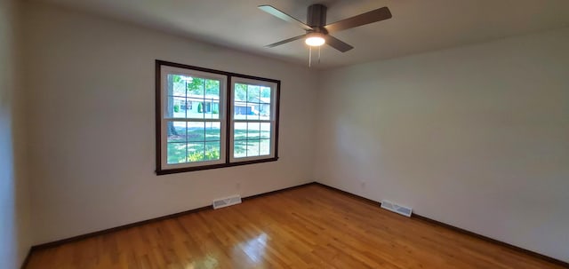 spare room featuring ceiling fan and light wood-type flooring