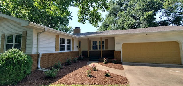 ranch-style house featuring a garage