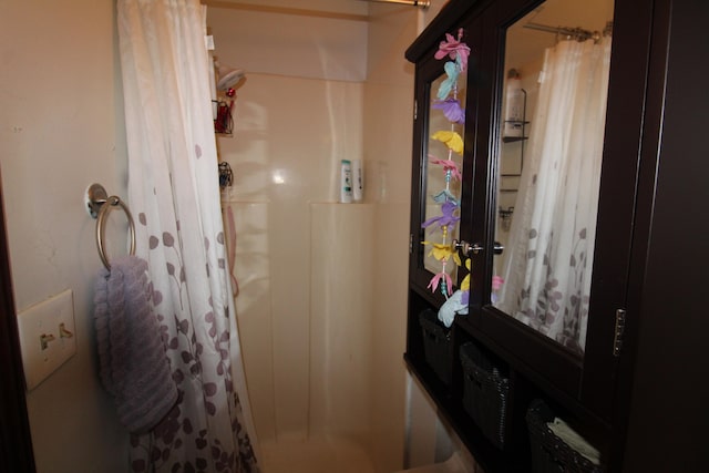 bathroom with a shower with curtain