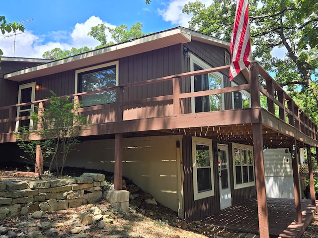 view of home's exterior with a wooden deck