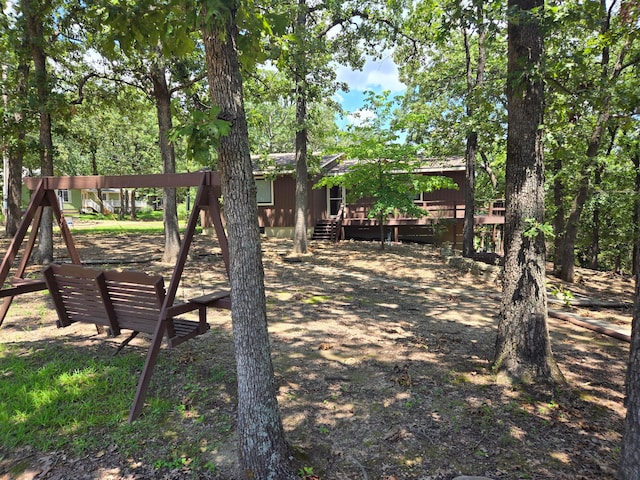 view of yard featuring a wooden deck