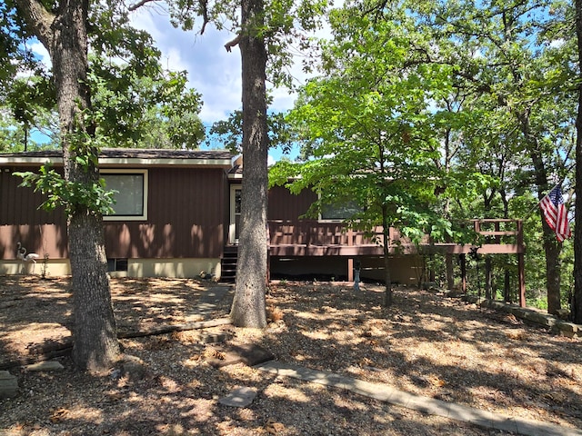 view of yard featuring a wooden deck