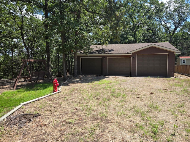 garage with a yard