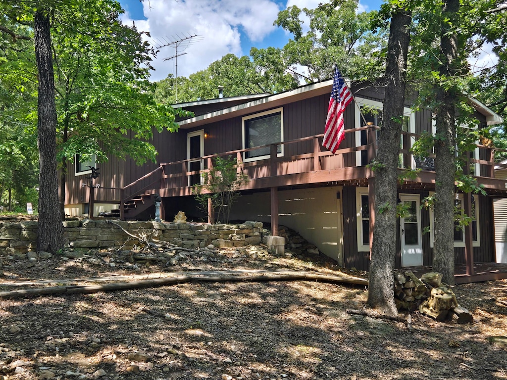 back of house with a wooden deck