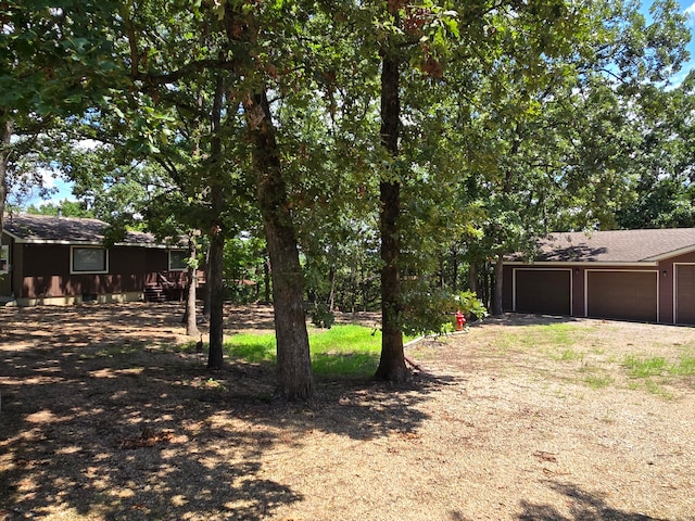 view of yard featuring a garage