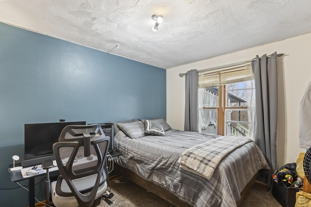 carpeted bedroom with a textured ceiling