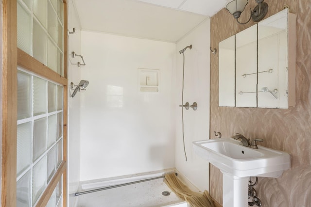 bathroom featuring sink and a shower