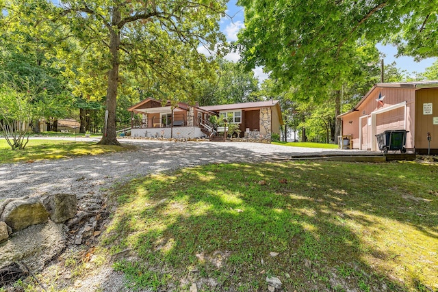 view of front facade with a garage and a front lawn