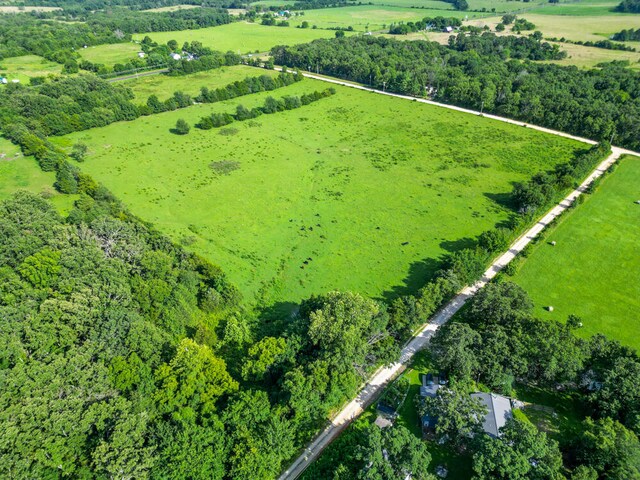 birds eye view of property featuring a rural view