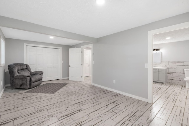 sitting room with tile walls