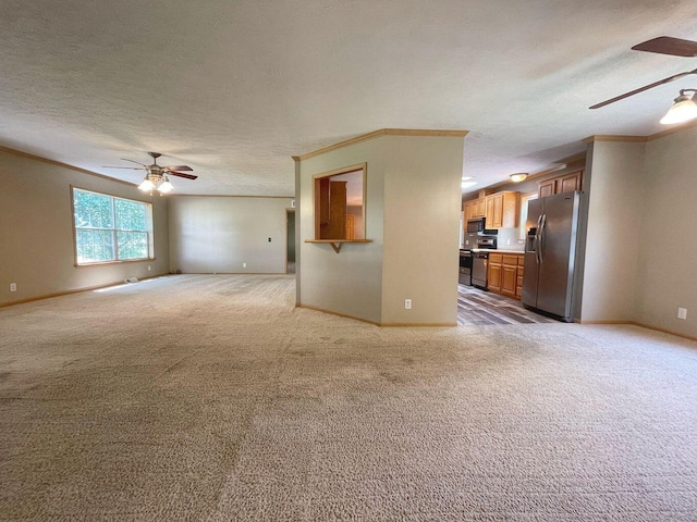 unfurnished living room with light carpet, a textured ceiling, crown molding, and ceiling fan