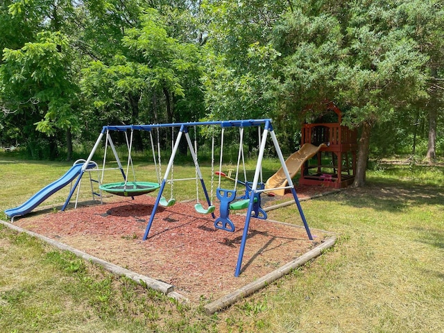 view of jungle gym with a lawn