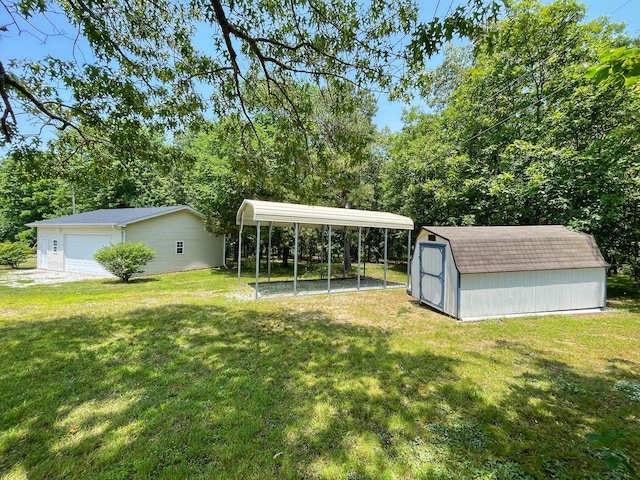 view of yard featuring a garage, a storage shed, and a carport