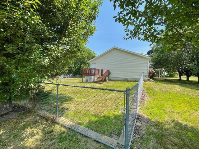 view of yard featuring a fenced backyard and a deck