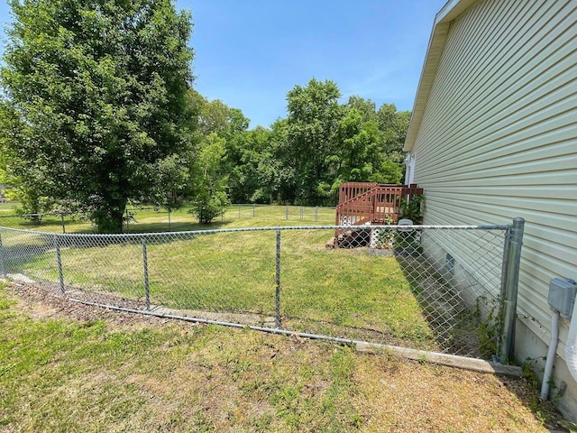 view of yard with a wooden deck