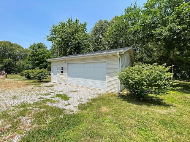 garage featuring a yard