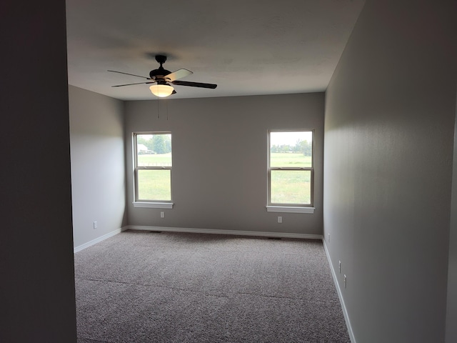 carpeted empty room with ceiling fan