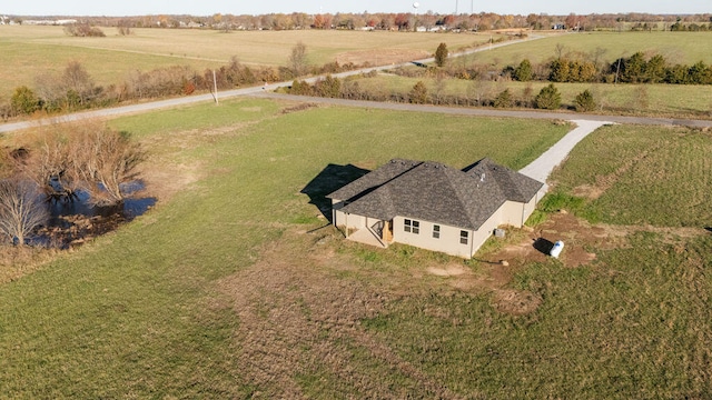 birds eye view of property with a rural view