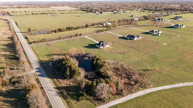 birds eye view of property featuring a rural view