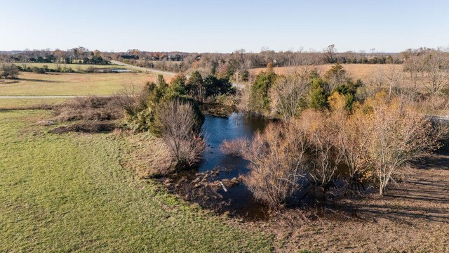 aerial view with a rural view and a water view