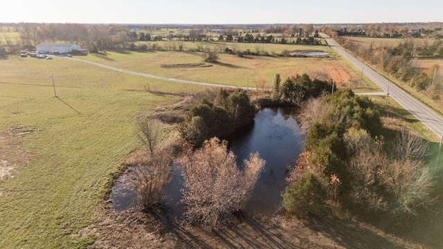 birds eye view of property featuring a rural view and a water view