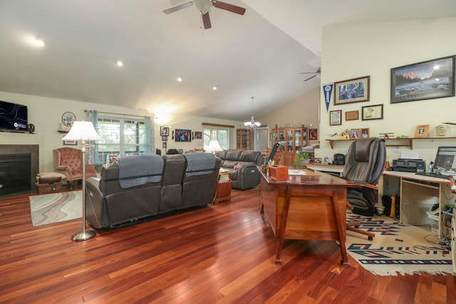 living room featuring hardwood / wood-style floors, ceiling fan with notable chandelier, and lofted ceiling