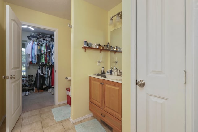 bathroom featuring tile patterned floors and vanity