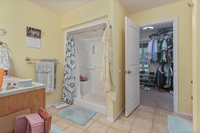 bathroom with tile patterned flooring and curtained shower