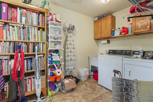 laundry room featuring cabinets and washing machine and clothes dryer