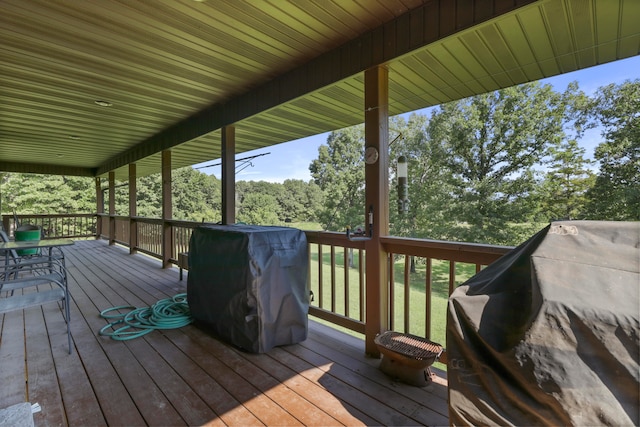 wooden terrace featuring grilling area