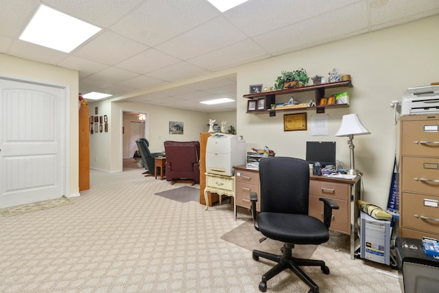 carpeted office space featuring a drop ceiling