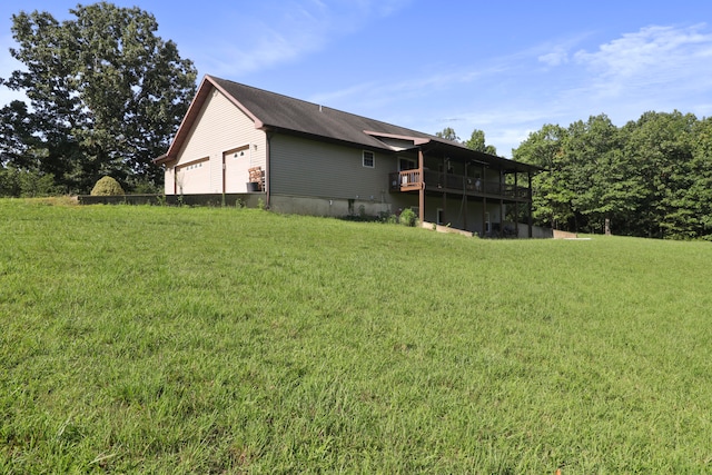 view of yard with a deck and a garage