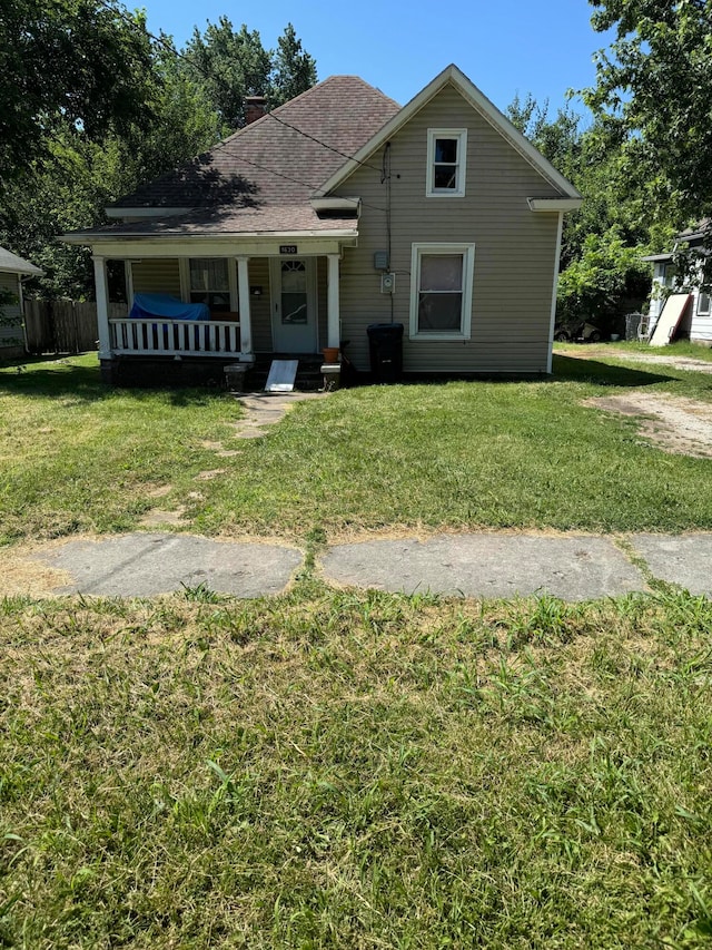 bungalow-style home featuring a front yard