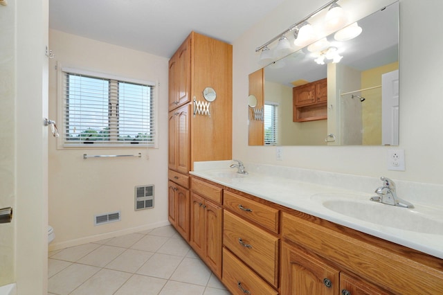 bathroom with vanity, toilet, heating unit, walk in shower, and tile patterned flooring