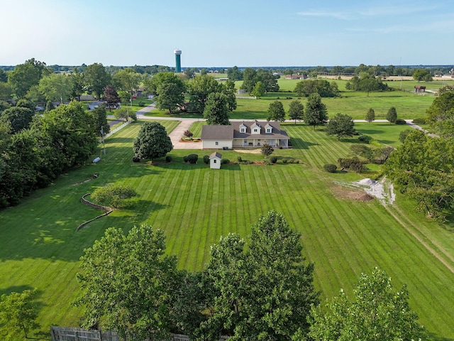 birds eye view of property with a rural view