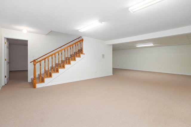 basement with light colored carpet