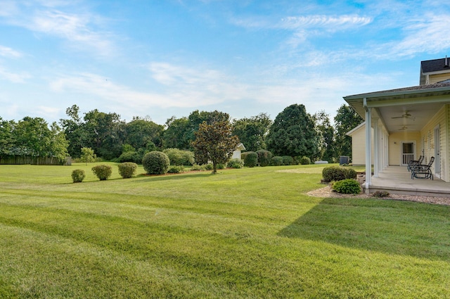 view of yard with a patio and ceiling fan