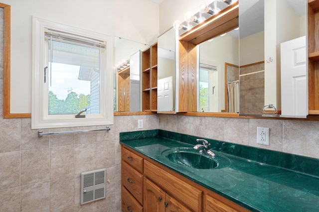 bathroom featuring walk in shower and vanity